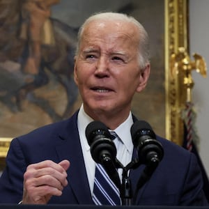 Joe Biden speaks at a podium during a press conference.