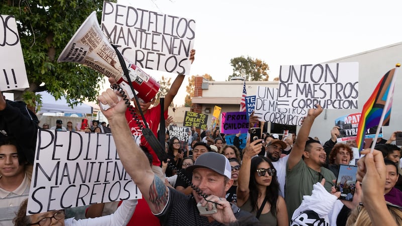 Bryce Henson (center front) at a rally, brandishing his bullhorn.