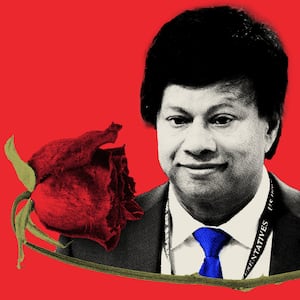 Photo illustration of Shri Thanedar atop a wilted red rose on a red background.