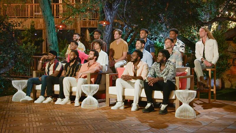 The contestants of F Boy Island sitting during deliberation