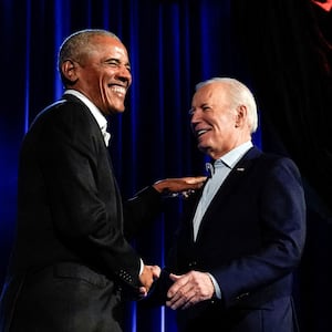 Barack Obama laughing with Joe Biden