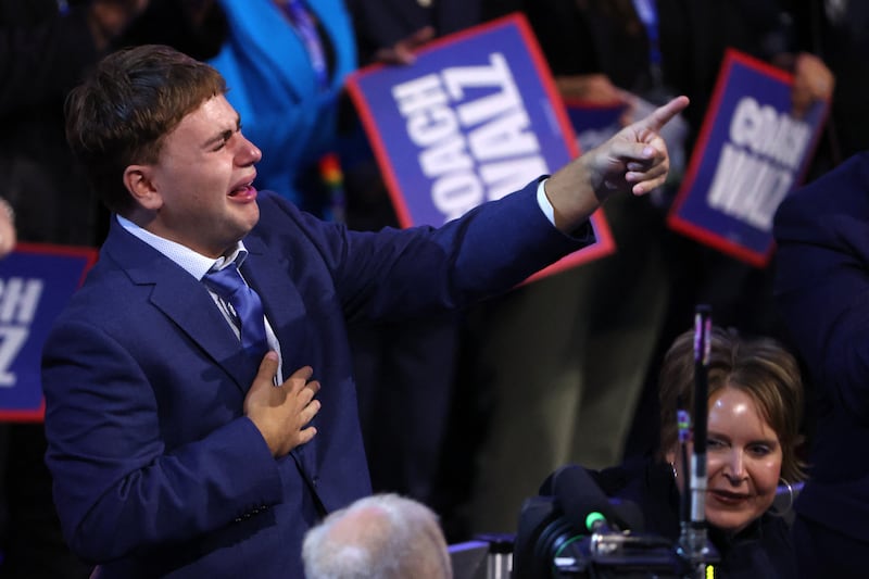 Gus, the son of Minnesota Governor Tim Walz, reacts to his father’s speech on Day 3 of the Democratic National Convention.