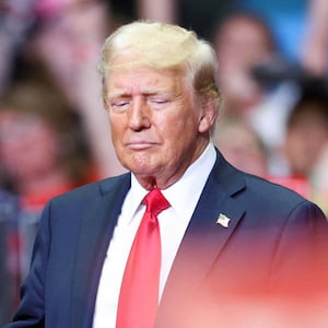 Republican presidential nominee and former U.S. President Donald Trump stands with Republican vice presidential nominee U.S. Senator J.D. Vance (R-OH), as he holds a rally for the first time with his running mate, in Grand Rapids, July 20, 2024.