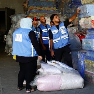 UNRWA workers sort aid to be delivered to Gazans.