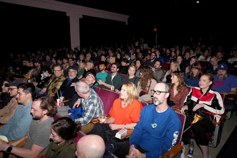 A crowd of patrons sit in their seats at Vidiots.