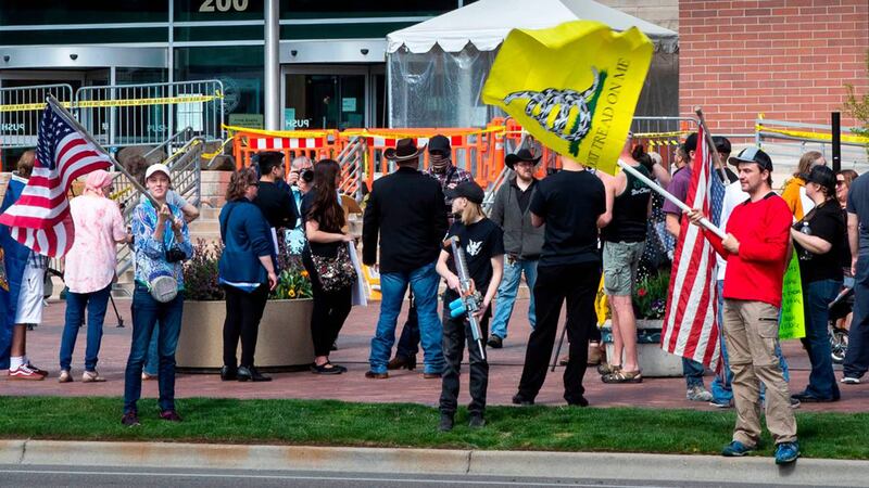 Supporters of Ammon Bundy gather in front of the Ada County Courthouse in April 2021