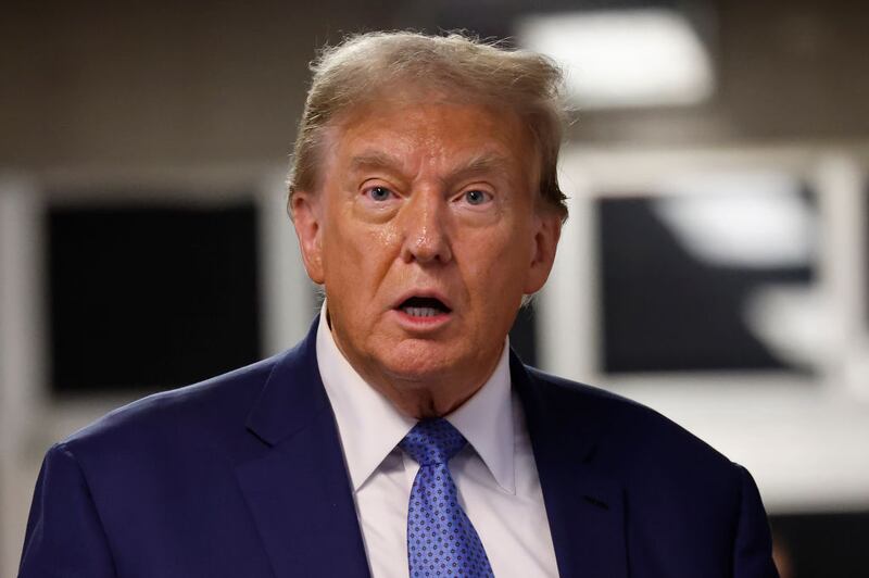 Former U.S. President Donald Trump speaks after exiting the courtroom during his hush money trial at Manhattan Criminal Court.