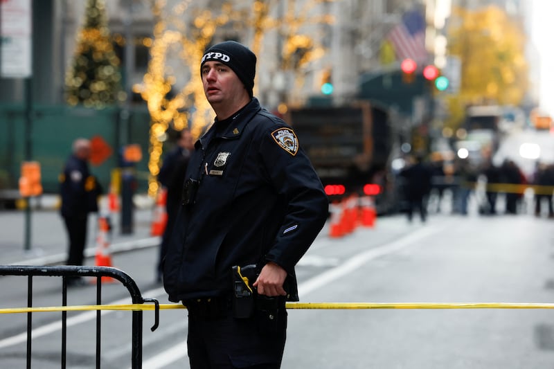 A police officer stands near the scene where the CEO of United Healthcare Brian Thompson was reportedly shot and killed in Midtown Manhattan, in New York City, US, December 4, 2024.