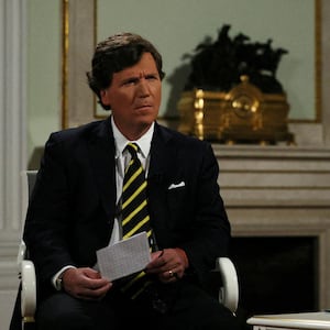 Tucker Carlson looking befuddled during an interview with Vladimir Putin on Feb. 6 in Moscow.