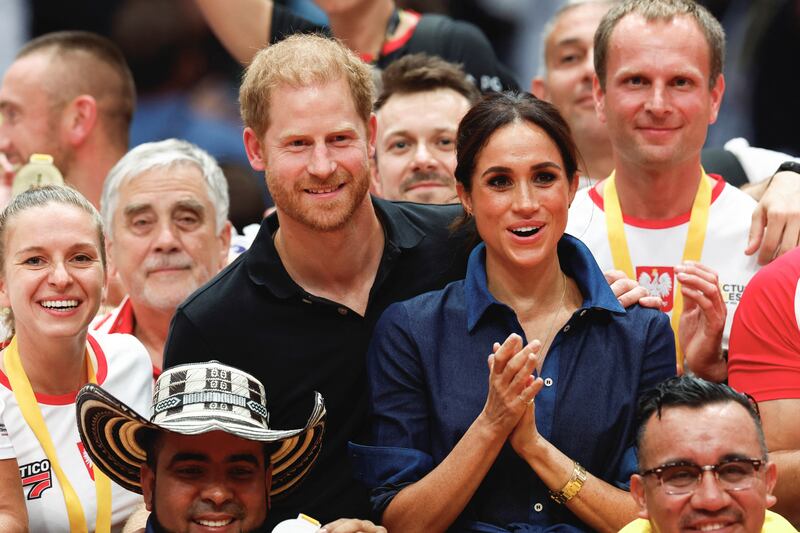 Harry and Meghan pose with the medalists after the sitting volleyball final at the 2023 Invictus Games, an international multi-sport event for injured soldiers, in Duesseldorf, Germany September 15, 2023.