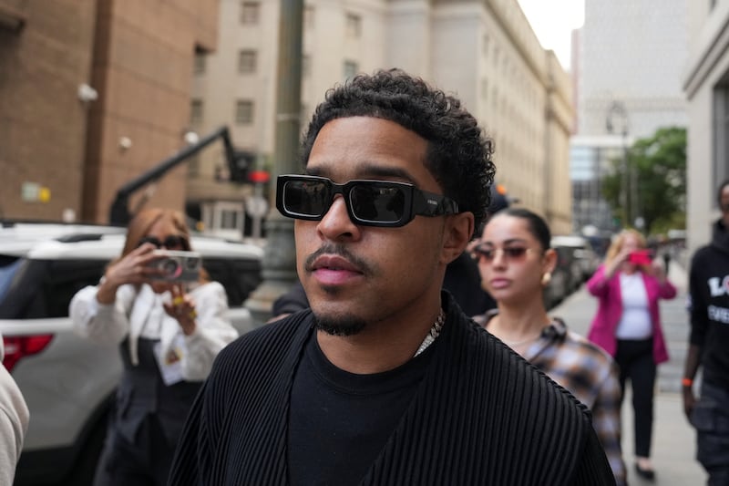 Justin Combs walks outside in Manhattan wearing sunglasses.