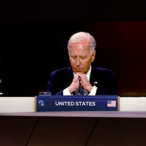 President Joe Biden is seen on a screen as he delivers remarks at a meeting of the heads of state of the North Atlantic Council at the 2024 NATO Summit.