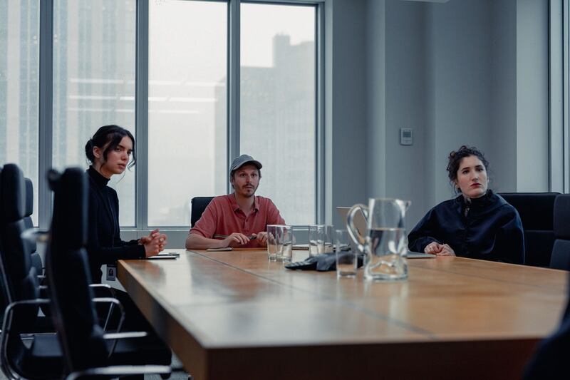 Michael Cera and Kate Berlant sit at a table in a still from ‘Dream Scenario’