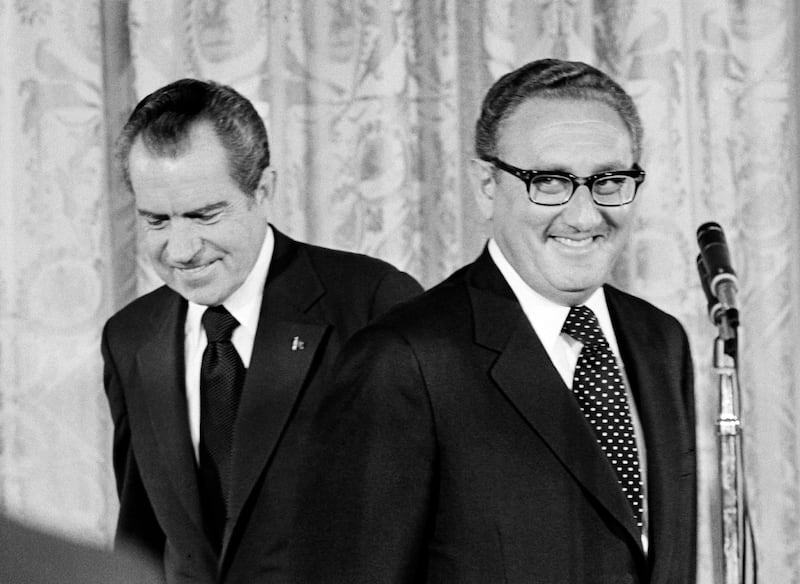 A photo including former U.S. President Richard Nixon and newly appointed Secretary of State Henry Kissinger