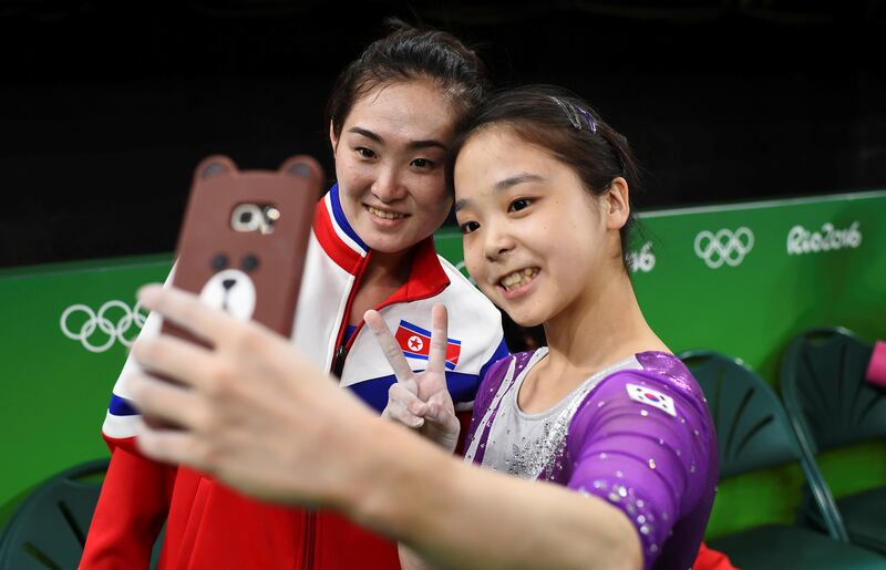 Lee Eun-Ju of South Korea takes a selfie picture with Hong Un Jong of North Korea.   