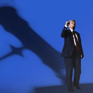 Donald Trump with a raised fist looking ahead as a giant court gavel shadow looms over him.