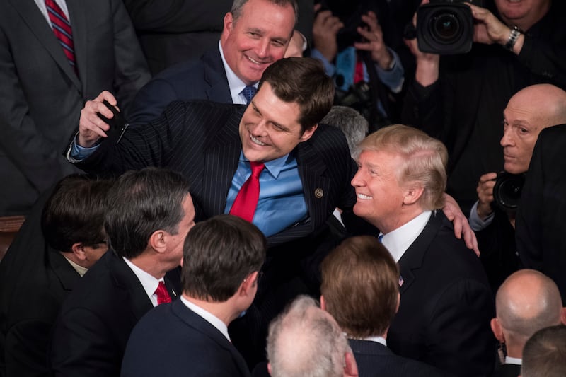 President Donald Trump takes a selfie with Rep. Matt Gaetz after the State of the Union address in 2018.