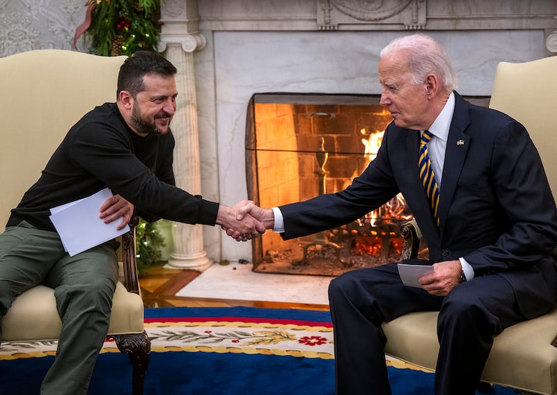 President Joe Biden, right, shakes hands with President Volodymyr Zelenskyy of Ukraine.