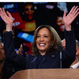 Side-by-side of Kamala Harris accepting applause and Donald Trump staring forward.