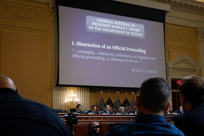 A picture of the members looking at a presentation about the investigation on the January 6 insurrection