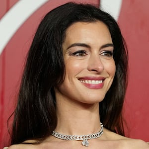 Anne Hathaway poses on the red carpet of the annual Fashion Awards at the Royal Albert Hall in London, Britain, December 4, 2023.