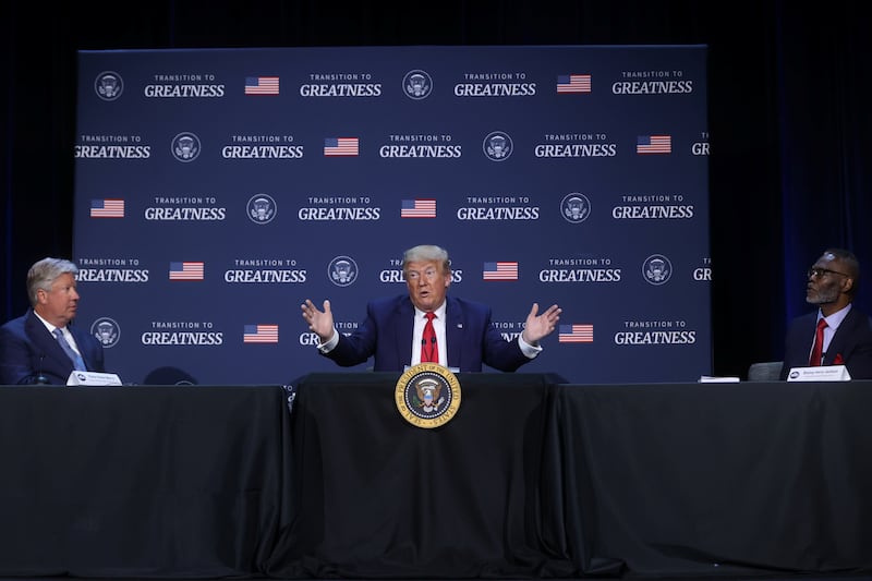 Then-President Donald Trump is flanked by Pastor Robert Morris and Gateway Church Bishop Harry Jackson during a roundtable at Gateway Church in June 2020. 