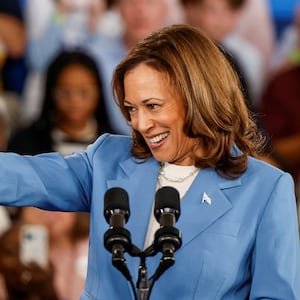  Kamala Harris gestures as she speaks at an event at the Hendrick Center for Automotive Excellence in Raleigh, NC.