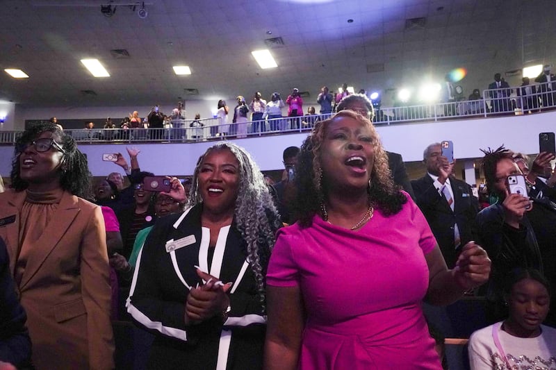 Congregants at the Divine Faith Ministries International in Jonesboro, Georgia