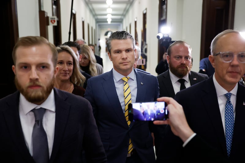 U.S. President-elect Donald Trump's nominee to be Secretary of Defense Pete Hegseth and his wife Jennifer Rauchet walk through the Russell Senate Office building on Capitol Hill on December 3, 2024 in Washington, DC. Hegseth continues to meet with Senate Republicans on Capitol Hill as new allegations of alcohol abuse and sexual misconduct have emerged.