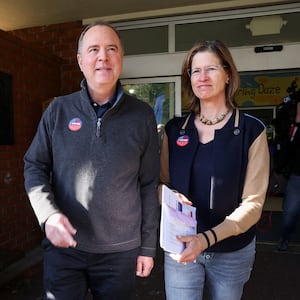 Democratic U.S. Senate candidate and U.S. Representative Adam Schiff (D-CA) walks with his wife Eve after they voted during Super Tuesday primary election in Burbank, California.