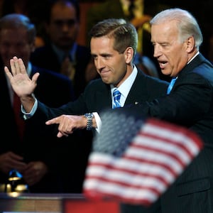 US Democratic vice presidential candidate Senator Joe Biden (D-DE) (R) waves with his son Beau Biden at the 2008 Democratic National Convention in Denver, Colorado.