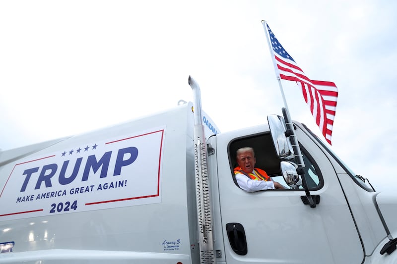 Republican presidential nominee and former U.S. President Donald Trump sits inside garbage truck, in Green Bay, Wisconsin, U.S., October 30, 2024.