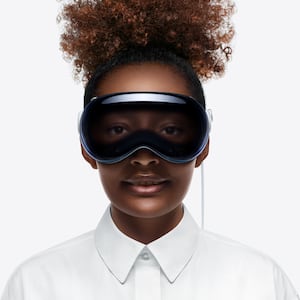 Apple Vision Pro headset on a woman. 