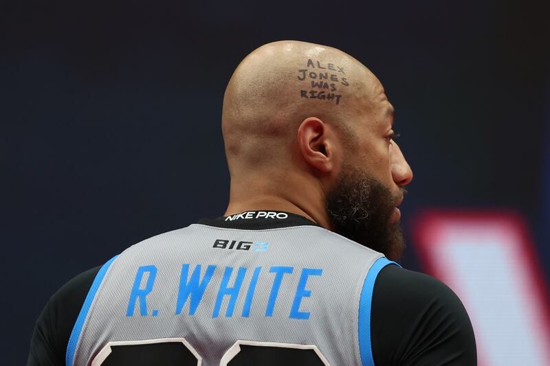 “Alex Jones Was Right” written on the head of Royce White.