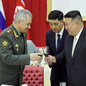 Russia's Defense Minister Sergei Shoigu toasts a glass with North Korean leader Kim Jong Un.