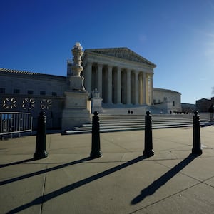 The sun casts shadows as it rises over the U.S. Supreme Court in Washington, U.S., December 20, 2023.