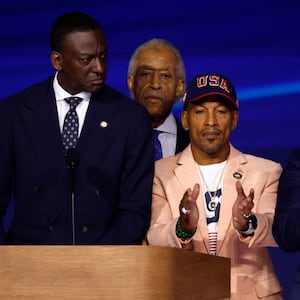 New York City Council Member Dr. Yusef Salaam, Activist Korey Wise and Activist Raymond Santana, representing “the Central Park Five,” stand with Rev. Al Sharpton on stage during the final day of the Democratic National Convention in Chicago.