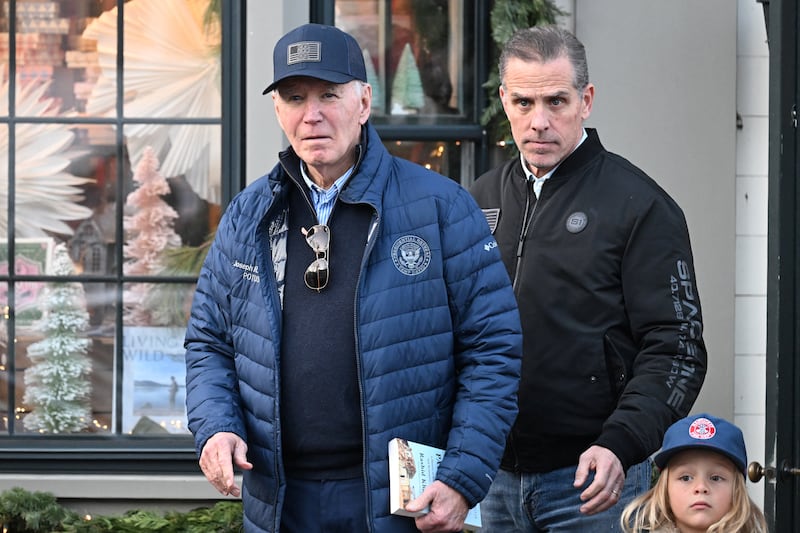 U.S. President Joe Biden, accompanied by Hunter Biden and Beau Jr., walks out of a bookstore in downtown Nantucket, Massachusetts, U.S., November 29, 2024.