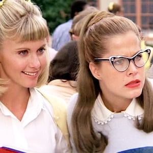 Olivia Newton-John as Sandy Olsen and Susan Buckner as Patty Simcox