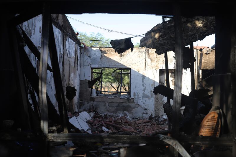 A photograph of damaged buildings in Kibbutz Be’eri and Kibbutz Kfar Aza.