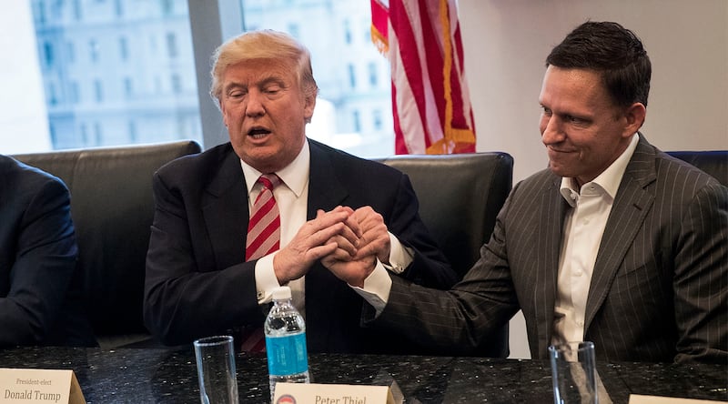 Donald Trump shakes the hand of Peter Thiel.