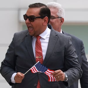 George Santos (R-NY) walks with his lawyer Joseph Murray outside the Central Islip Federal Courthouse on the day of his hearing