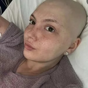 Leah Smith takes a selfie from a hospital bed.