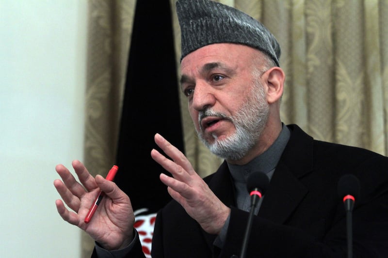 articles/2011/08/16/hamid-karzai-vows-no-third-term/karzai-moreau_rukwfe