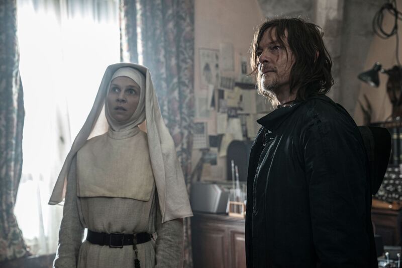 A still from The Walking Dead: Daryl Dixon showing Clémence Poésy as Isabelle and Norman Reedus as Daryl Dixon.