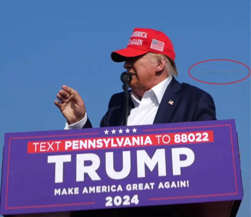 The bullet is seen in flight whizzing past Trump's head