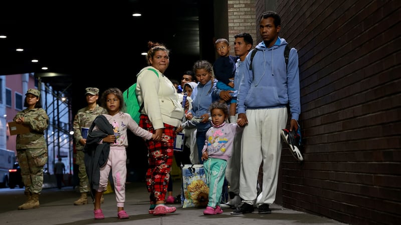 Photographs of migrants being dropped off in New York City