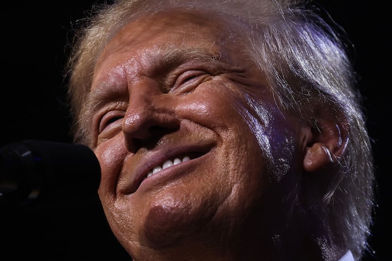 A close up of Donald Trump smiling. 