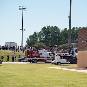 Students wait to be picked up by their parents after a shooting at Apalachee High School