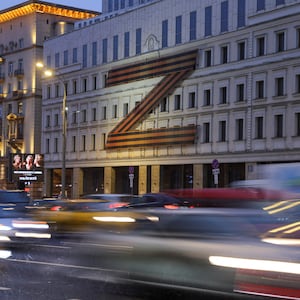 Cars drive past a theater with a “Z” symbol in Moscow, Russia, on Feb. 16, 2023.